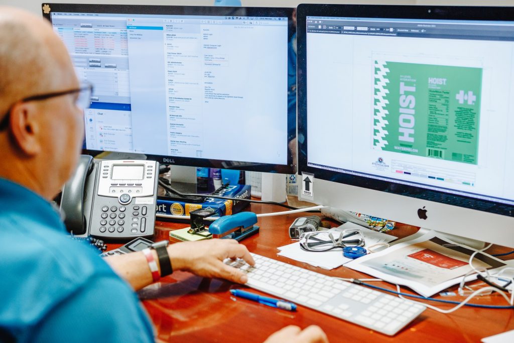 Steinhauser prepress manager looks at label file on a computer