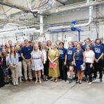 Steinhauser team posing with Kentucky Governor Andy Beshear at the ribbon cutting for Steinhauser's new hybrid printing press.