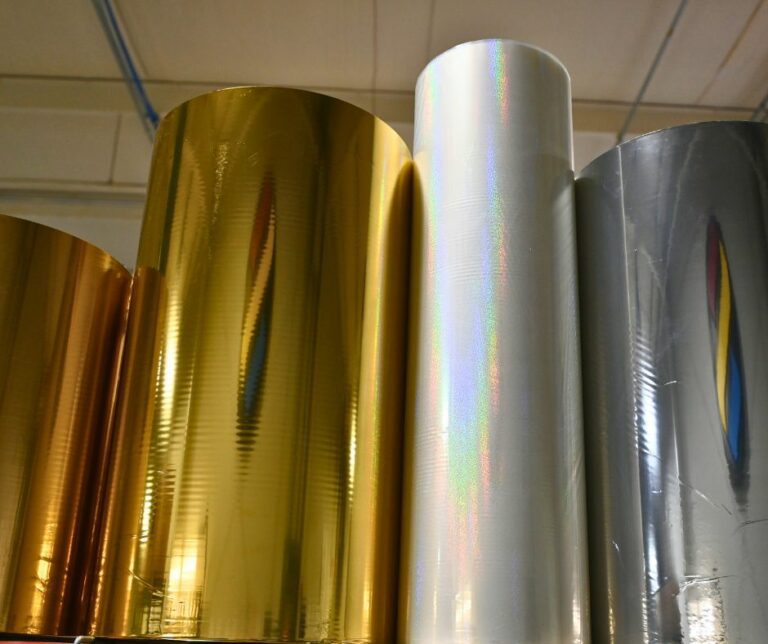 Rolls of foil stacked at Steinhauser, an option for adding decoration to custom labels