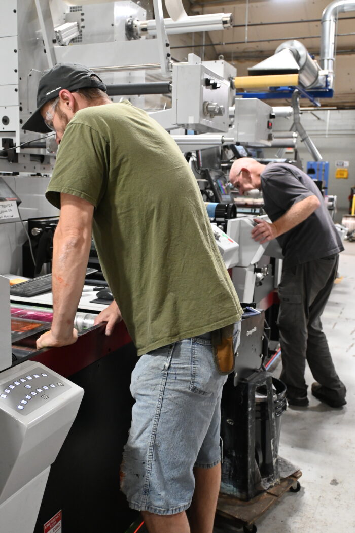 Two press operators at Steinhauser work on the Mark Andy hybrid press